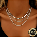 Cascade Argéntée Triple Layer Necklace Set – silver herringbone, curb and rope chains worn on neck