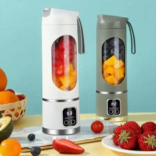 Pouring fresh juice from portable blender