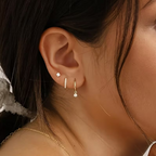 Éclat Dorée 3-Piece Earring Set – gold earrings styled on ear with chain necklace
